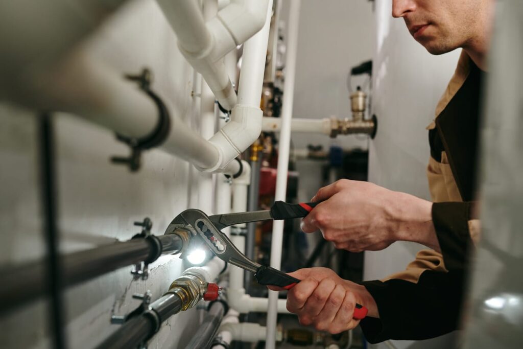 Plumbers maintaining commercial plumbing pipes in Wildomar