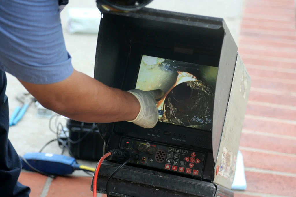 Technician viewing a drain inspection camera in Wildomar