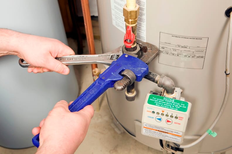 Plumber repairing a water heater valve in Wildomar